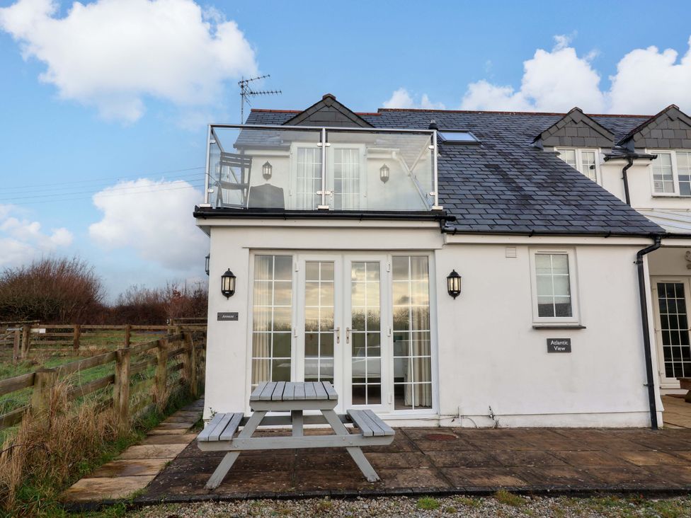 A balcony with seating at Atlantic View Apartment in Poundstock near Bude