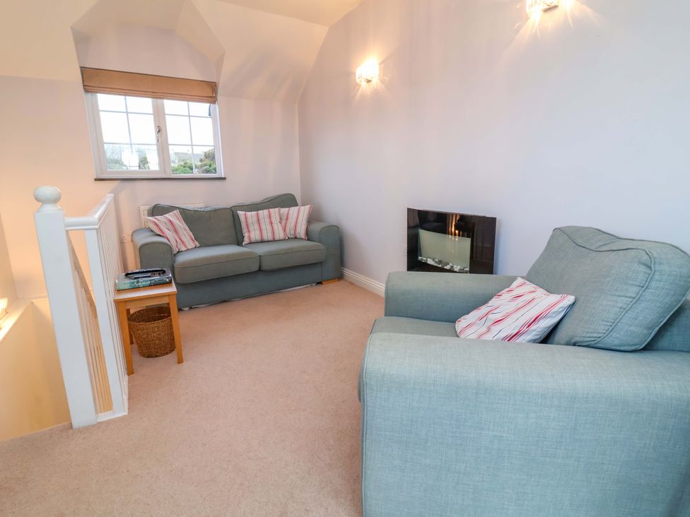 A living room with a sofa and armchair at Atlantic View Apartment Poundstock near Bude