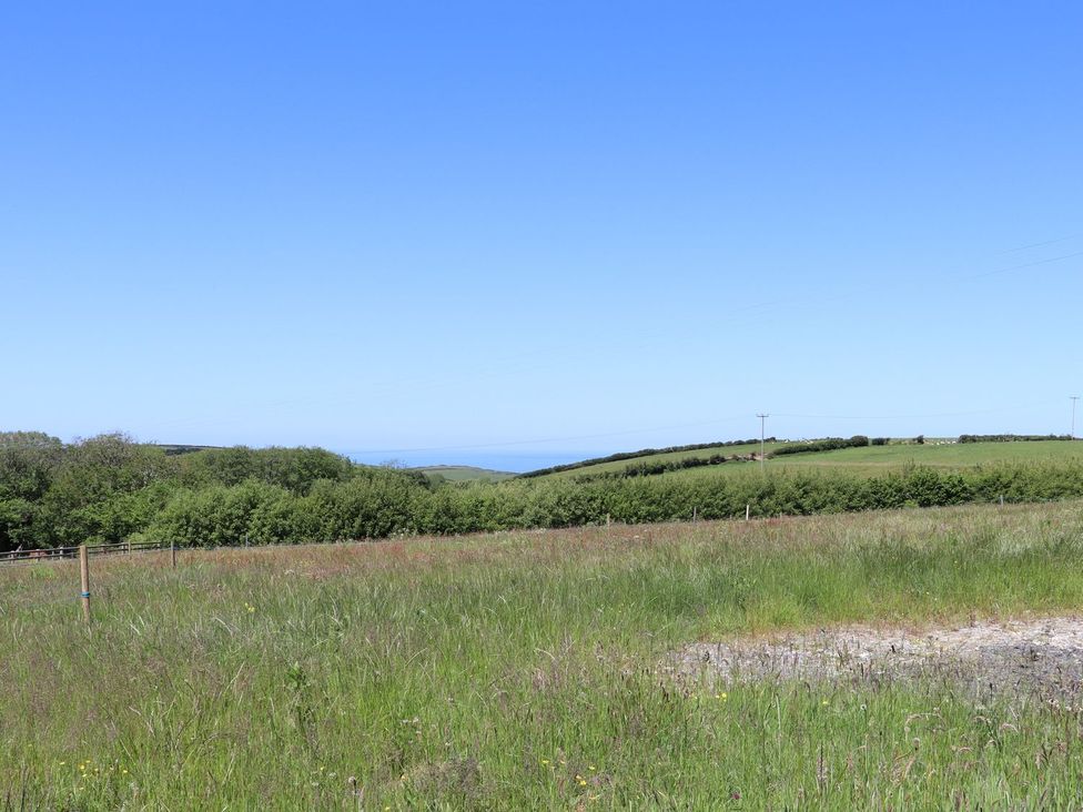 A view of hills and ocean at Atlantic View (3 bed) Bude