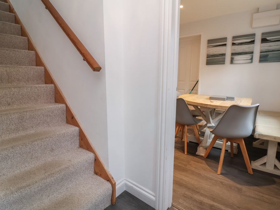 A dining room with a table and chairs at Atlantic View Poundstock near Bude