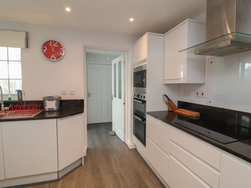 A kitchen with a sink and appliances at Atlantic View Poundstock near Bude