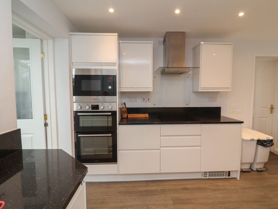 A kitchen with cabinets and appliances at Atlantic View near Bude