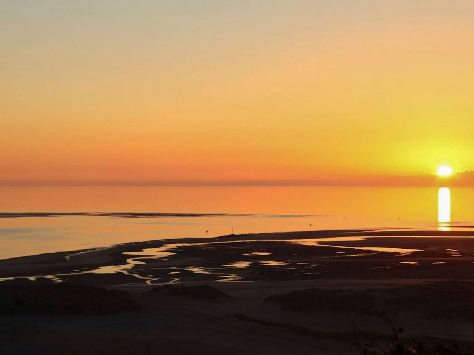 A sunset over the ocean at The Ingle in Barmouth