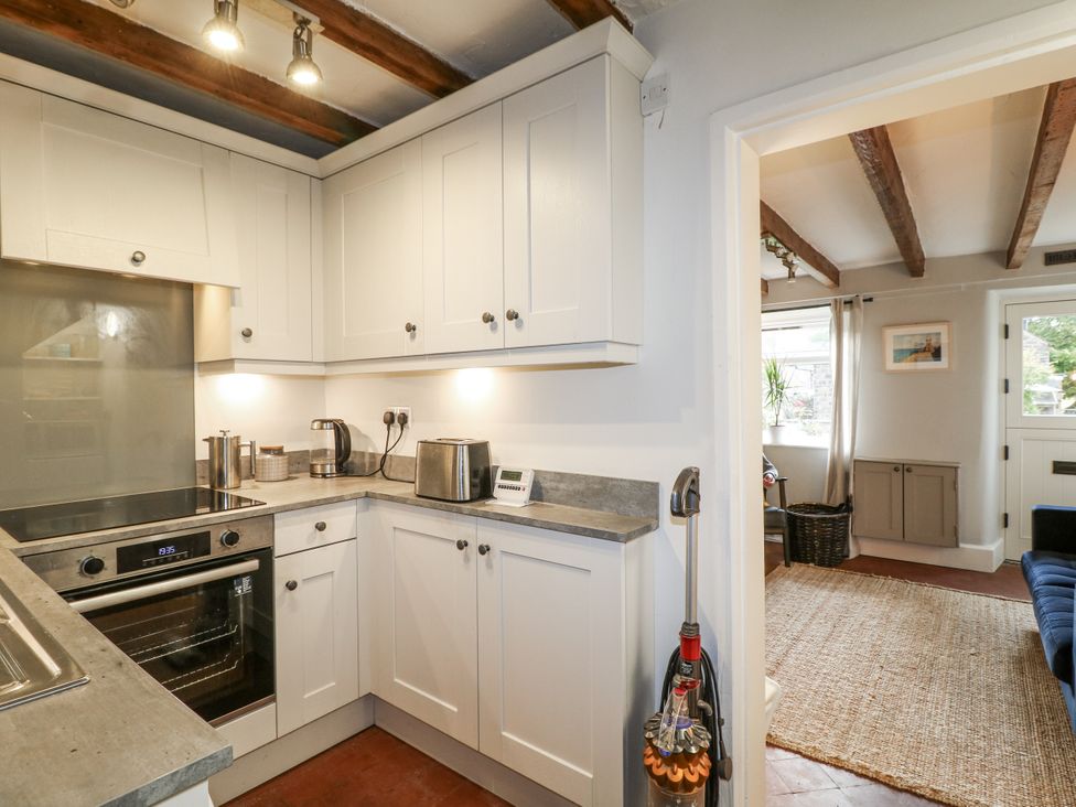 A kitchen with cabinets and appliances at 5 Belper Lane End in Belper