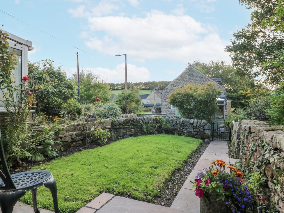 A garden with grass and stone wall at 5 Belper Lane End in Belper