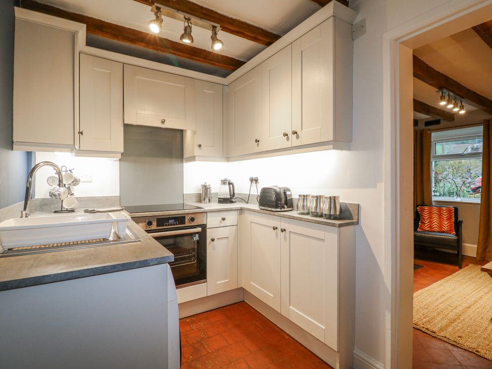 A kitchen with cabinets and appliances at 5 Belper Lane End in Belper