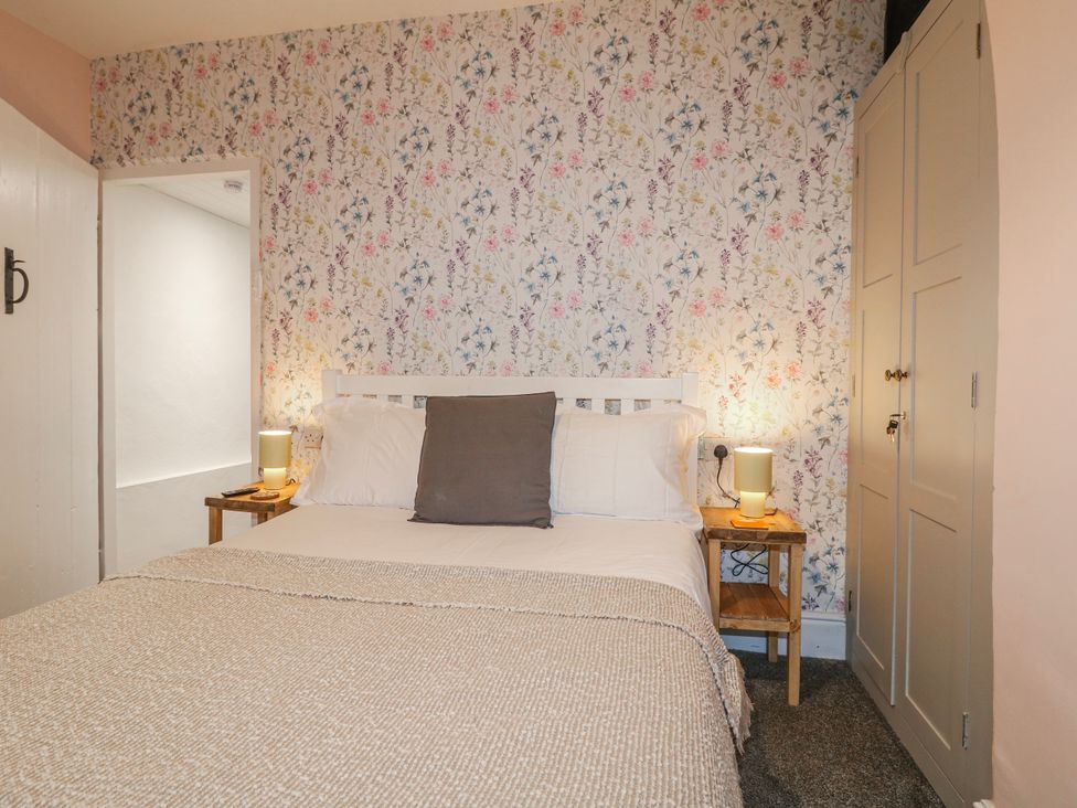 A bedroom with a bed and bedside tables at 5 Belper Lane End in Belper