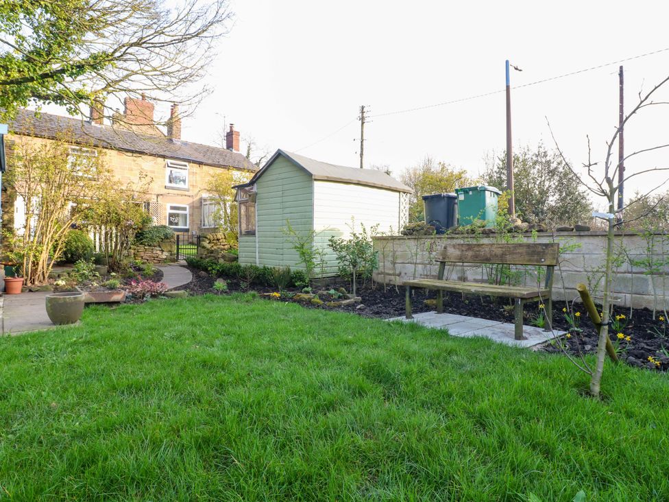 A garden with a shed, bench and plants at 5 Belper Lane End in Belper