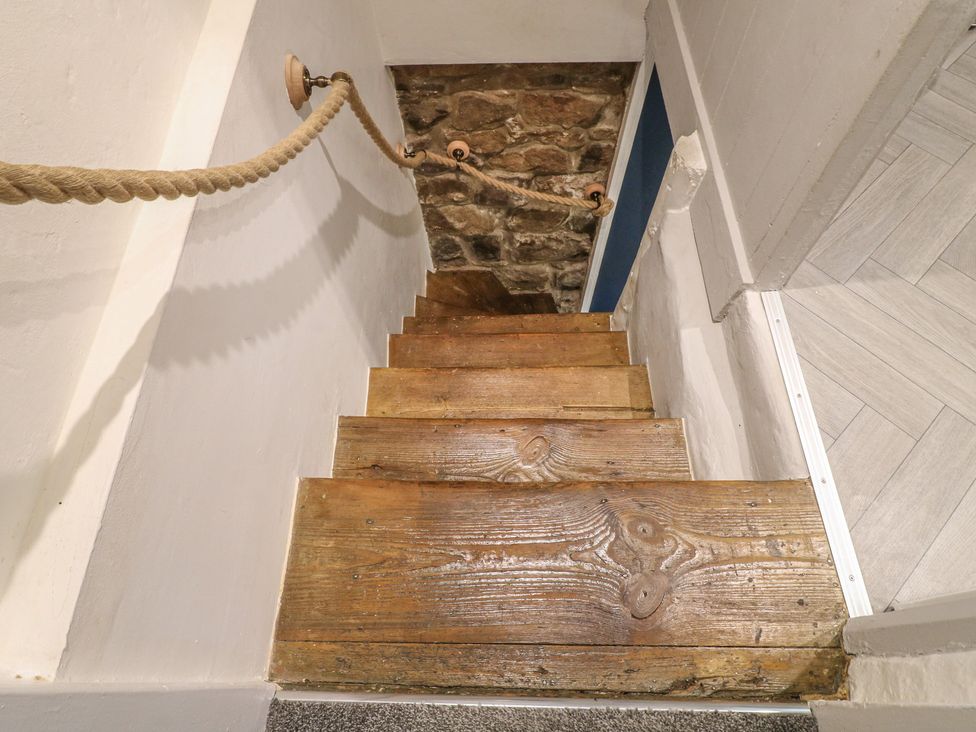 A staircase with wooden steps and a handrail at 5 Belper Lane End, Belper