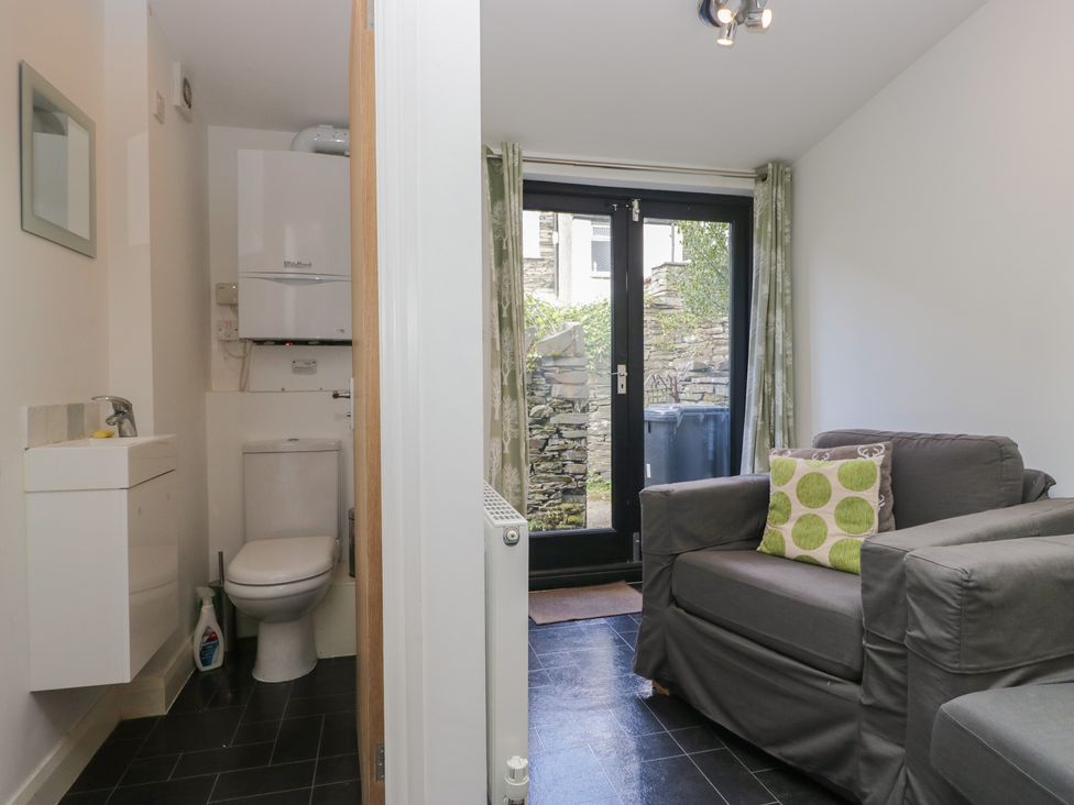 A bathroom with a toilet and sink at Cloud Cottage in Ambleside