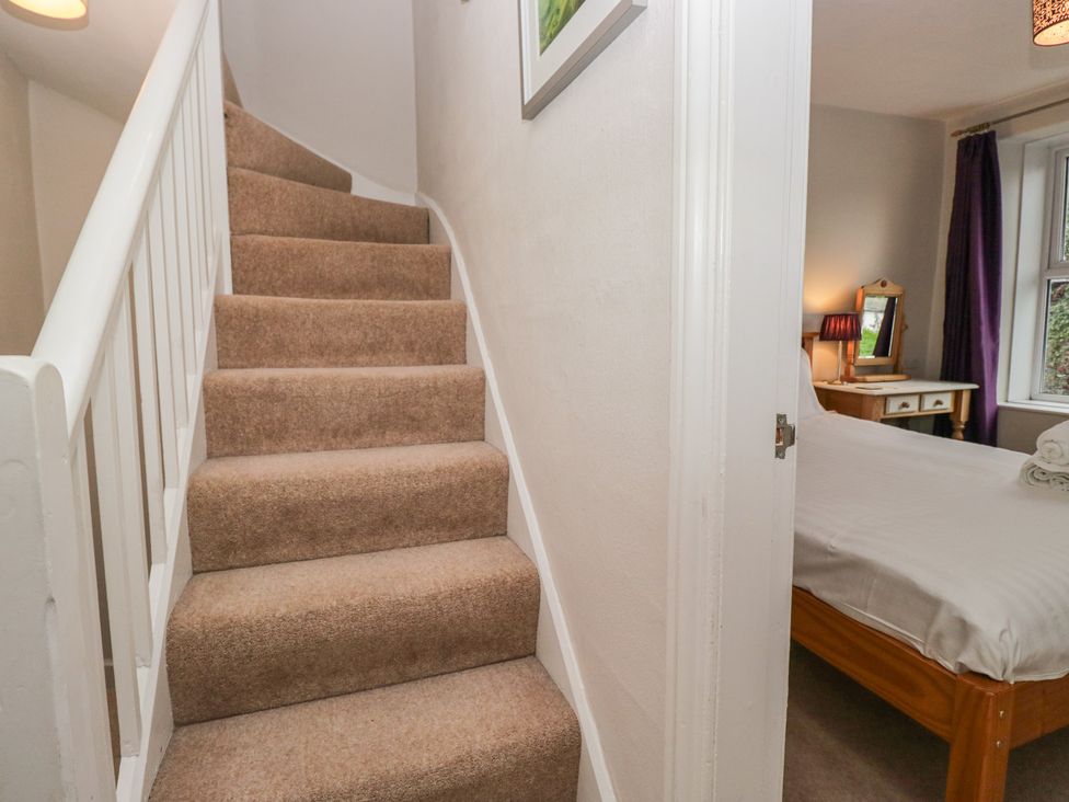 A staircase leading to a bedroom at Cloud Cottage Ambleside