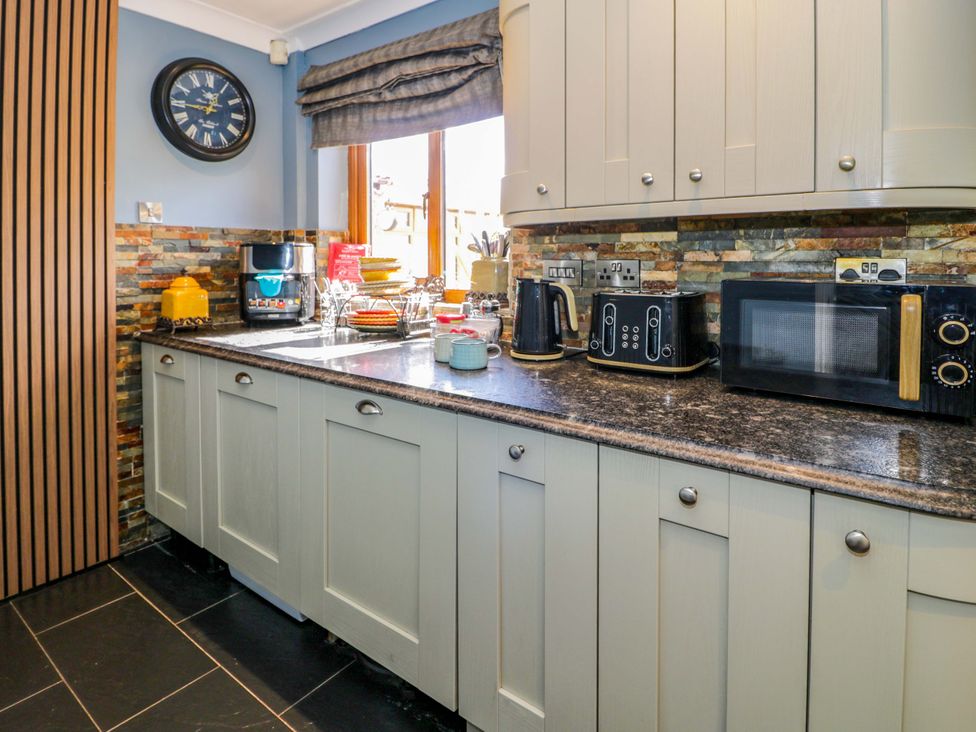 A kitchen with appliances and utensils at Pentre Country Studio near Chirk