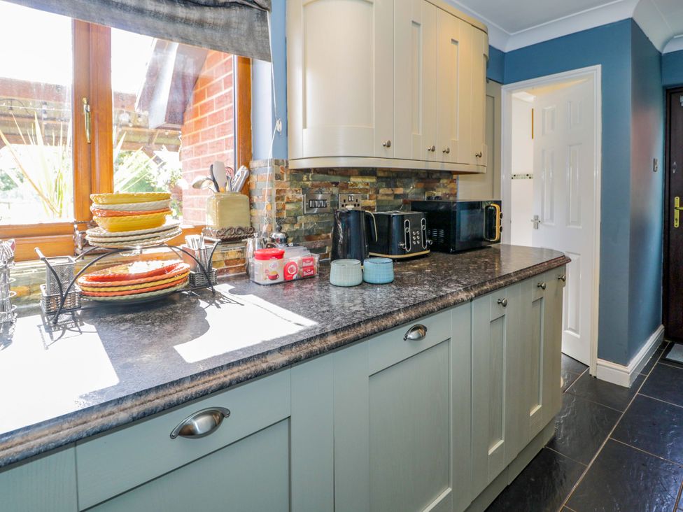 A kitchen with a countertop and appliances at Pentre Country Studio near Chirk