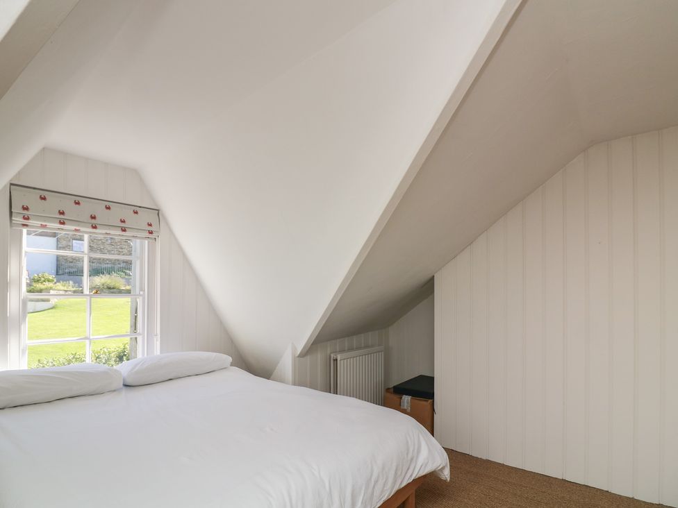 A bedroom with a bed and window at 36 Crowthers Hill in Dartmouth