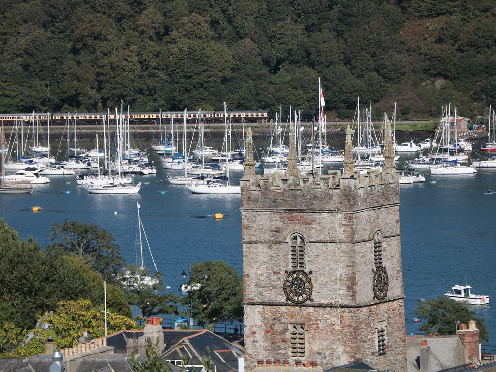 A view of a church tower and boats on water at 36 Crowthers Hill Dartmouth