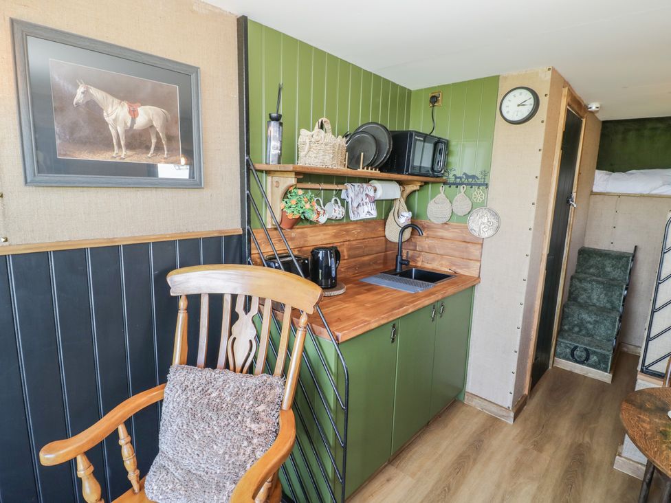 A kitchen with a sink and a microwave at GiGi's Horsebox in Evesham