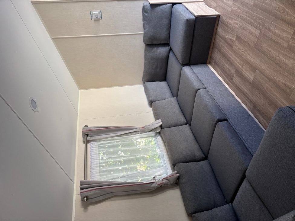 A living room with a sofa and window at 