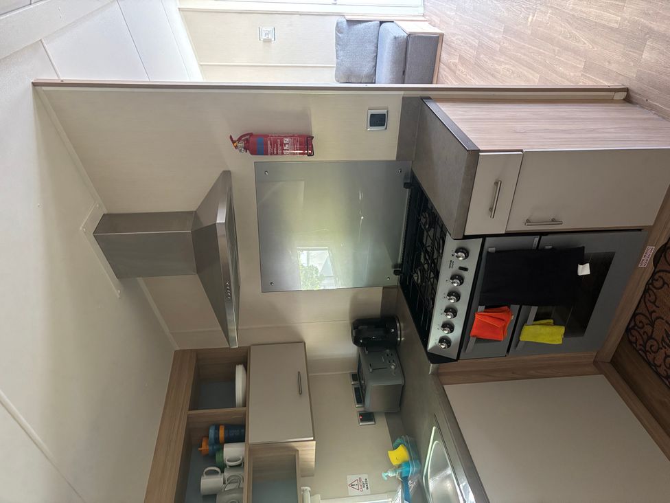 A kitchen featuring a stove and sink at the property