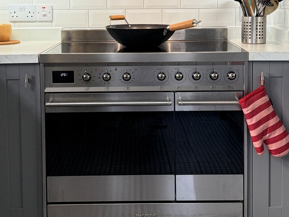 A kitchen with a stove and oven at Portknockie Cottage in Buckie