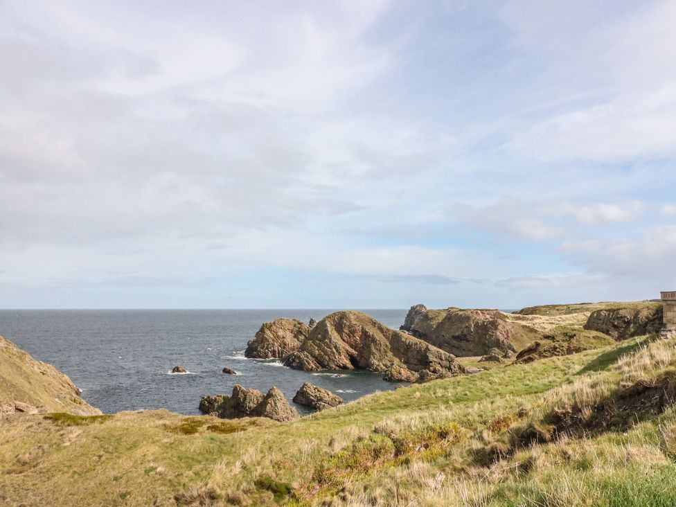 A view of cliffs and ocean at Portknockie Cottage in Portknockie
