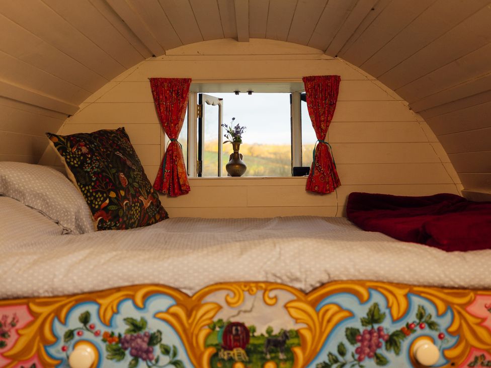 A bedroom with a bed and a window at Goldfinch in Launceston