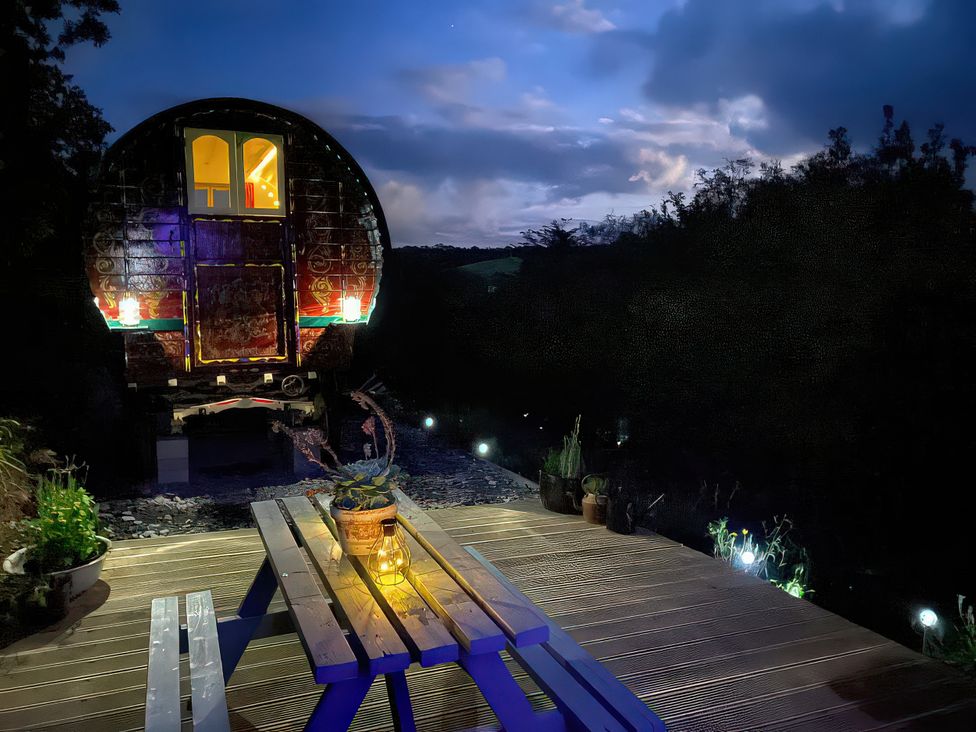 A truck parked on a deck with a table and plants at Goldfinch in Launceston