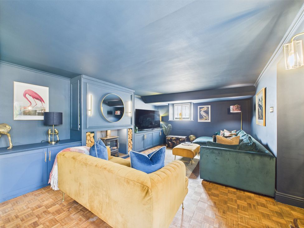 A living room with a television and sofa at 17C King Street in Barnard Castle