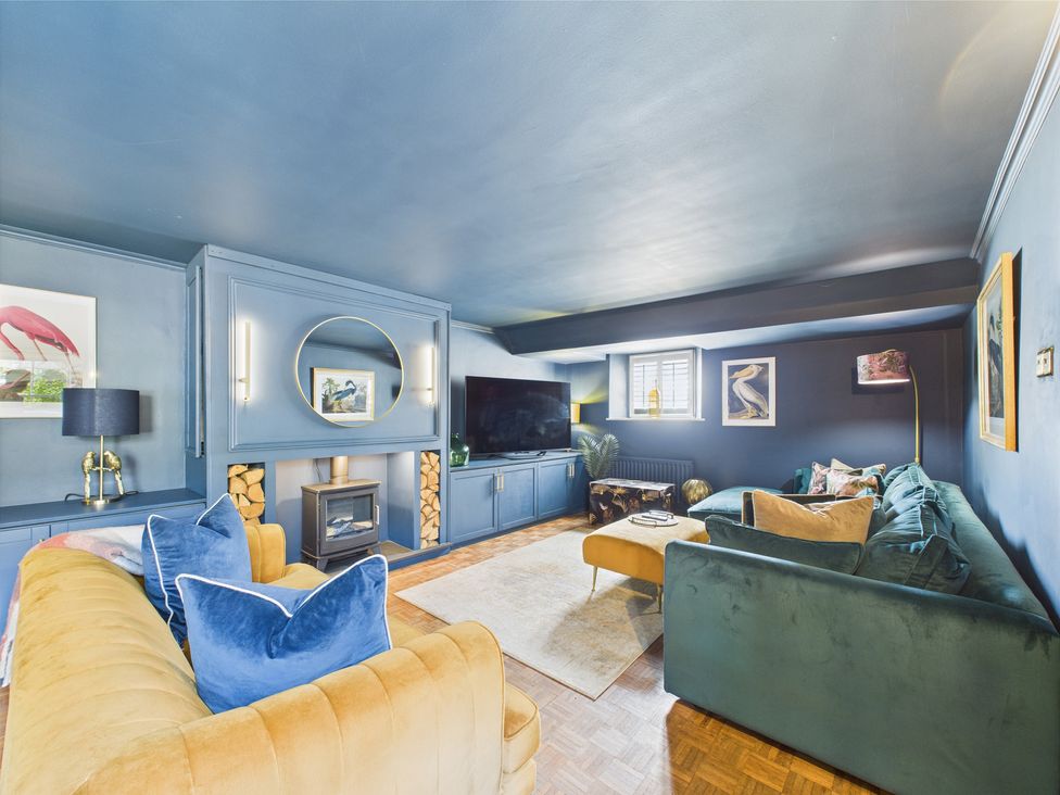 A living room with a sofa and television at 17C King Street Barnard Castle