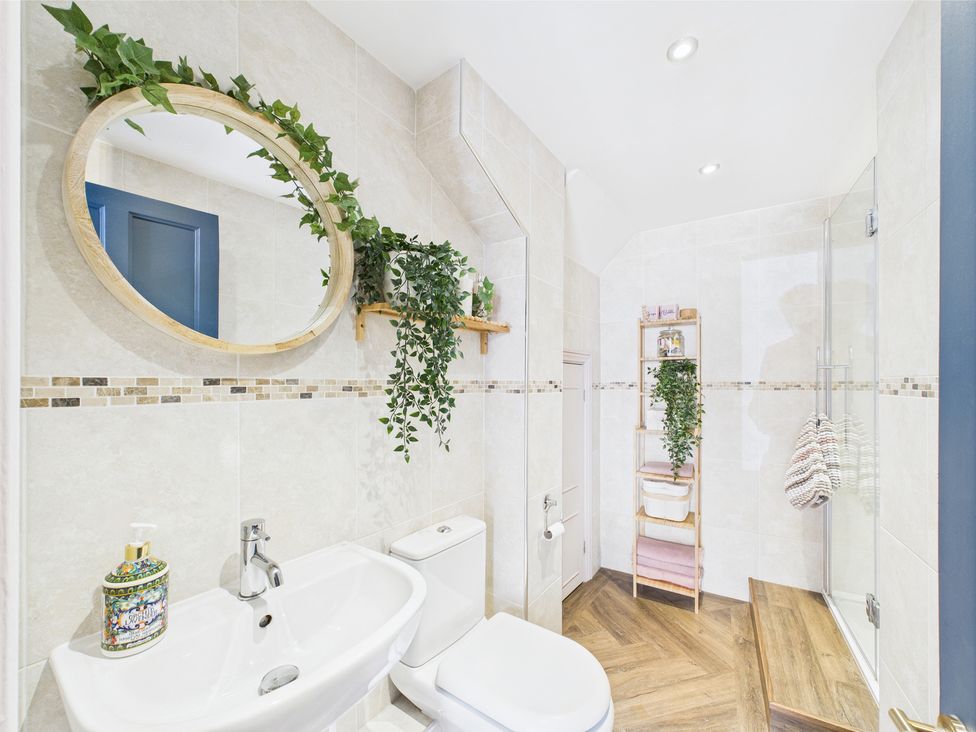 A bathroom with a sink and shower at 17C King Street in Barnard Castle