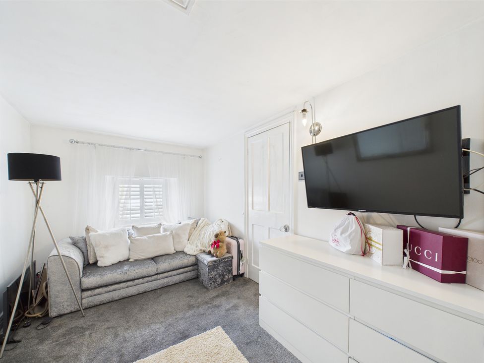 A living room with a sofa and television at 17C King Street Barnard Castle