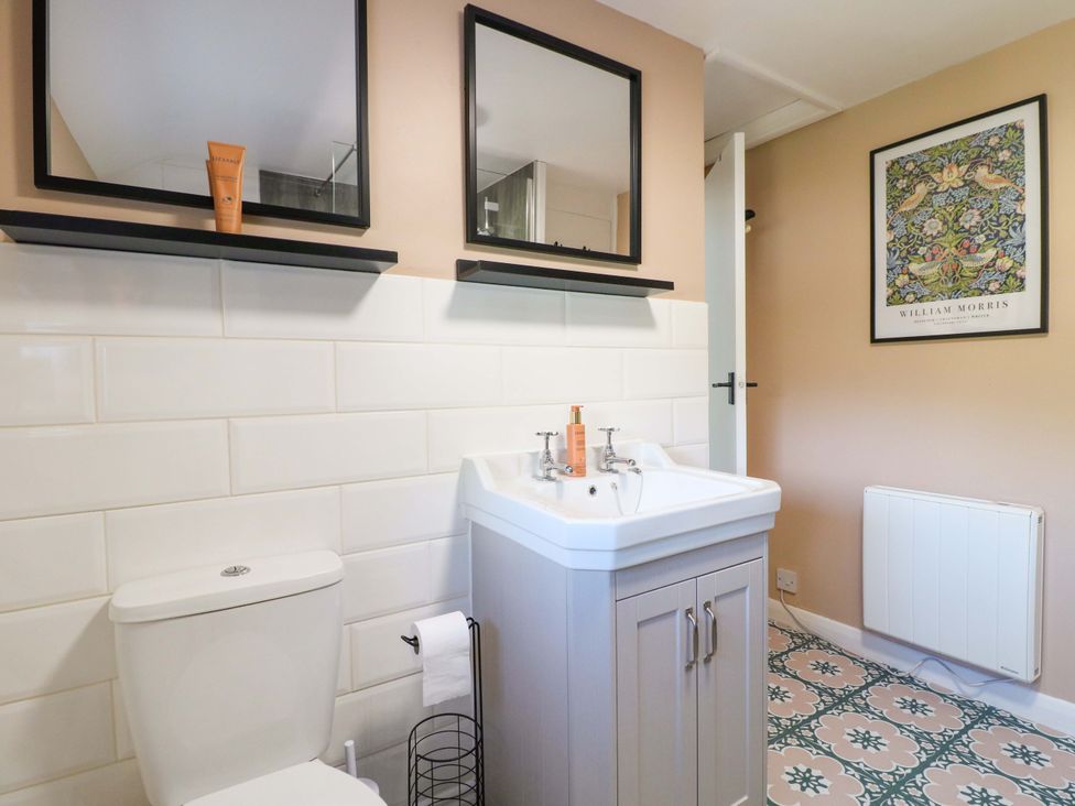 A bathroom with a sink and toilet at Prospect Cottage