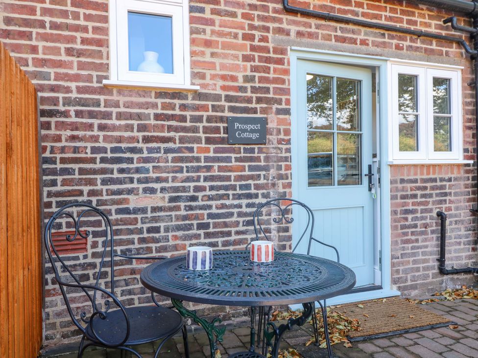 An outdoor area with a table and chairs at Prospect Cottage