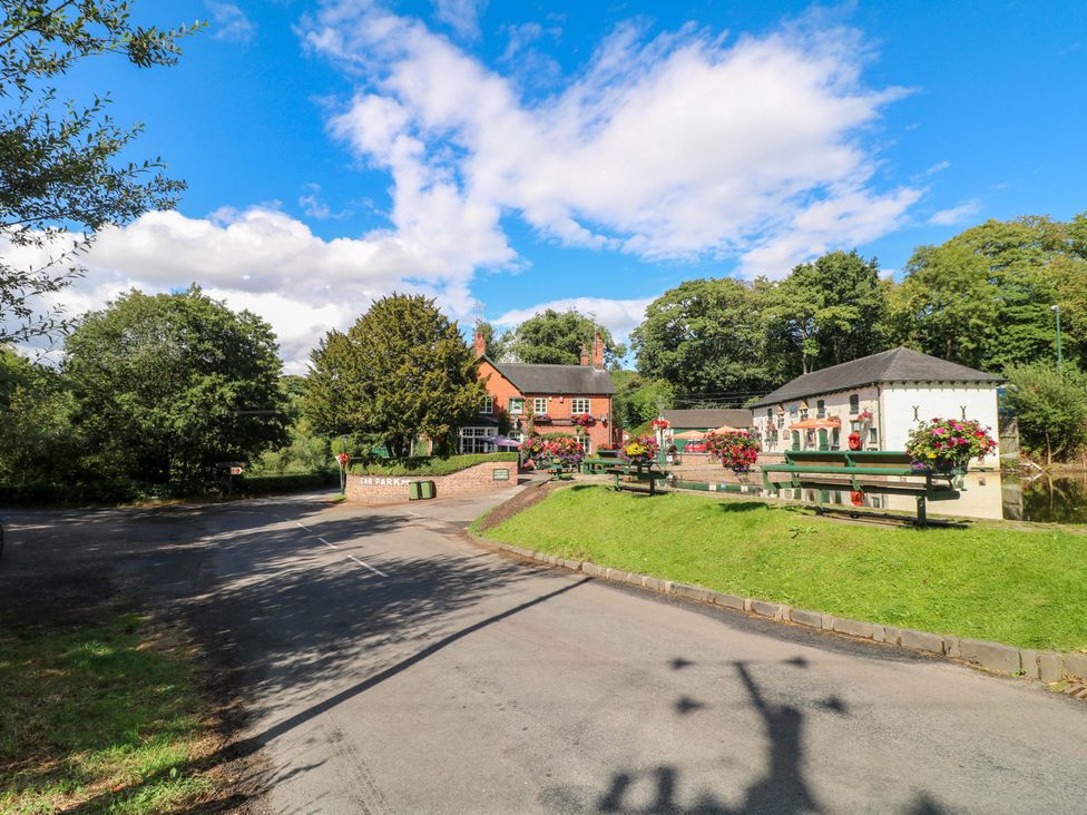 An outdoor area with houses and benches at Prospect Cottage