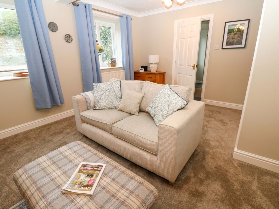 A living room with a sofa and coffee table at 1 Kyles Yard in Barnard Castle