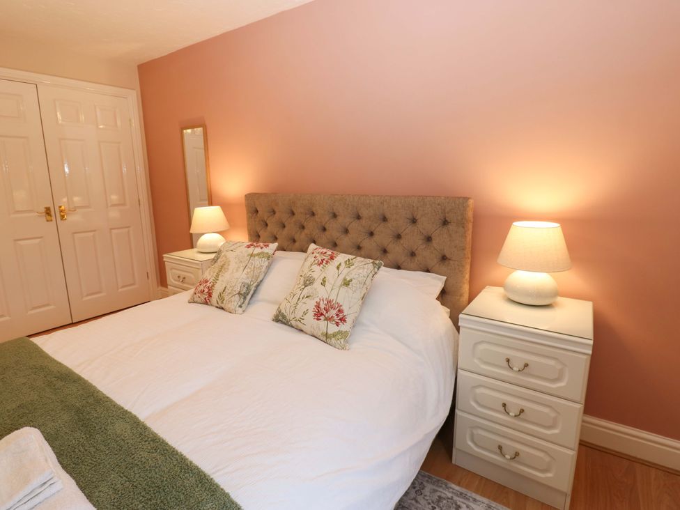 A bedroom with a bed and bedside tables at 1 Kyles Yard in Barnard Castle
