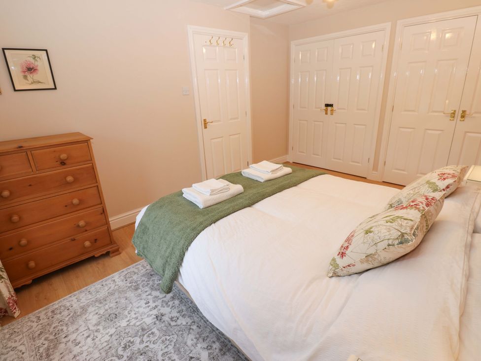A bedroom with a double bed and dresser at 1 Kyles Yard Barnard Castle