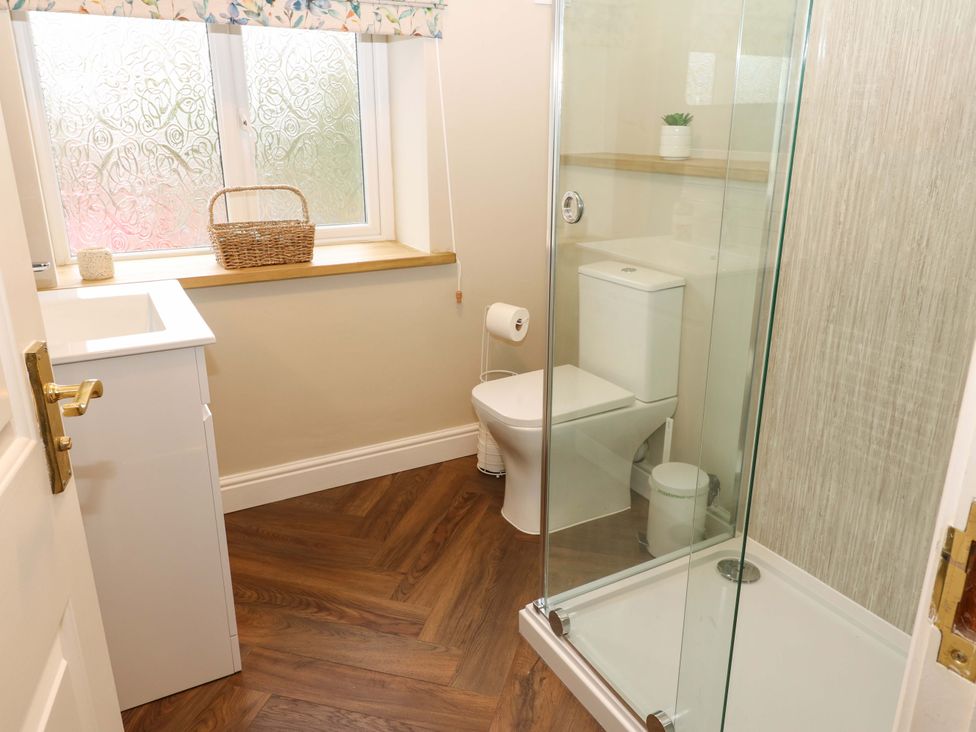 A bathroom with a shower and toilet at 1 Kyles Yard Barnard Castle