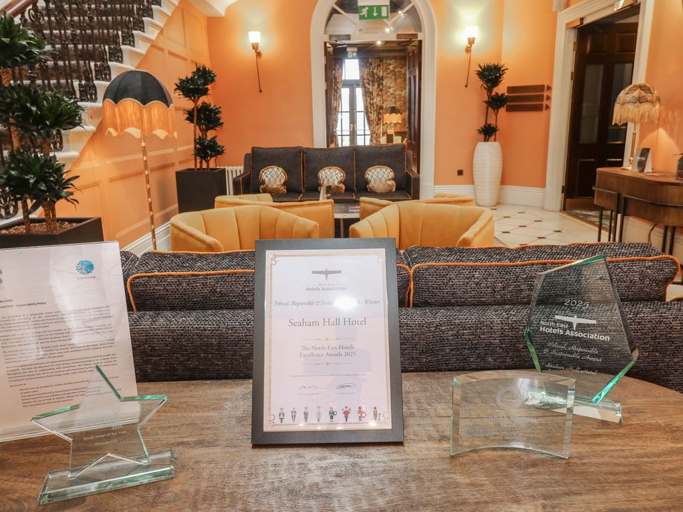 A lobby with awards and a certificate at Costal Lodge at Seaham Hall Seaham