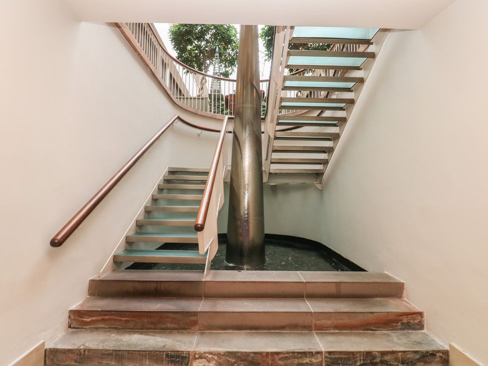 A staircase with handrail and plants at Costal Lodge at Seaham Hall Seaham
