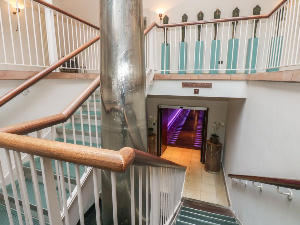 A stairway with a door leading to a spa at Costal Lodge at Seaham Hall Seaham