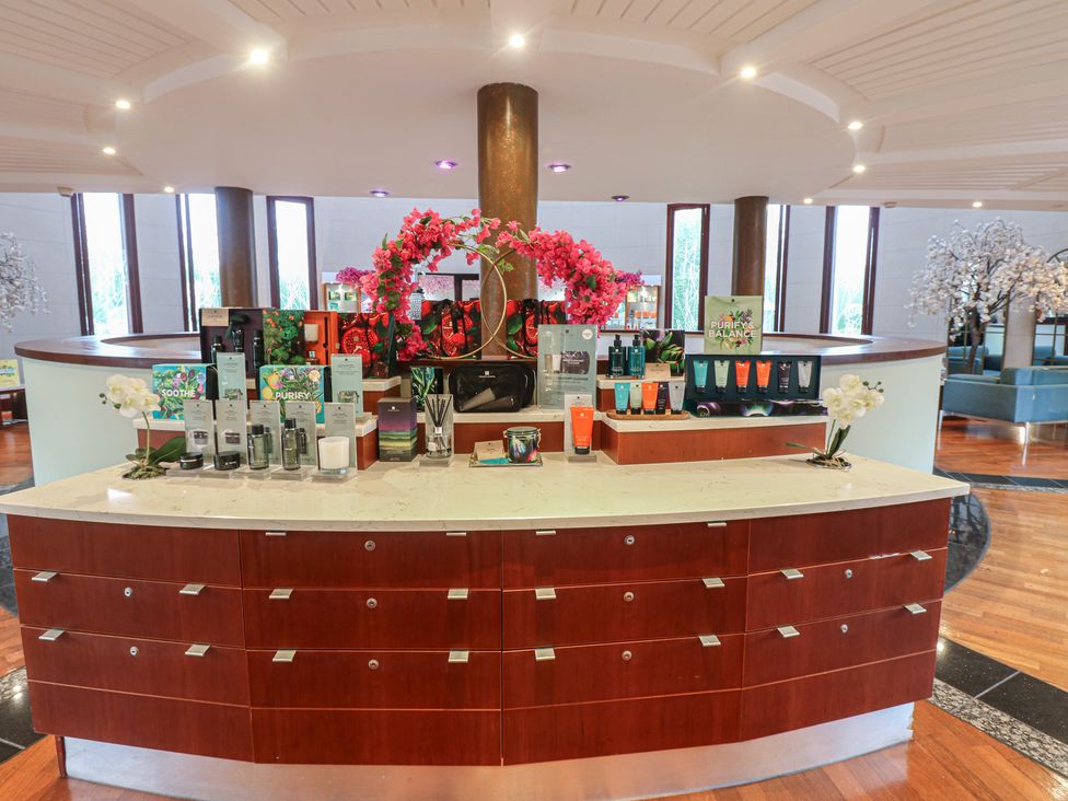 A reception desk displaying skincare products at Costal Lodge at Seaham Hall in Seaham