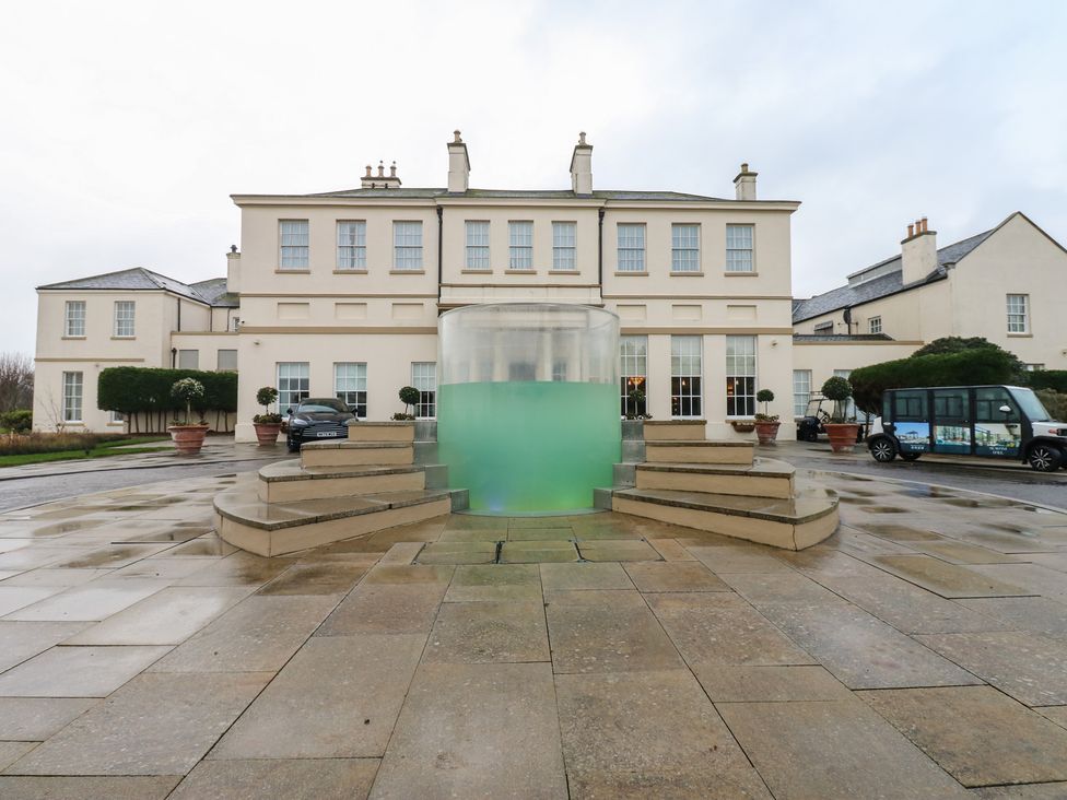 An outdoor area with a fountain and building at Costal Lodge at Seaham Hall Seaham