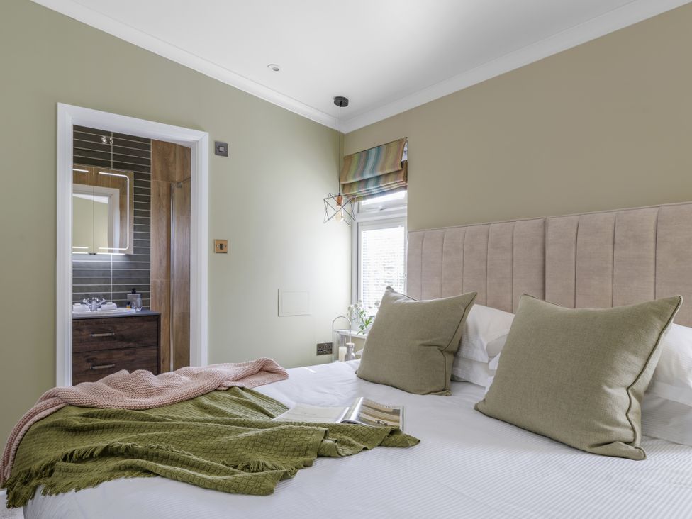 A bedroom with bed and bathroom view at Costal Lodge at Seaham Hall Seaham