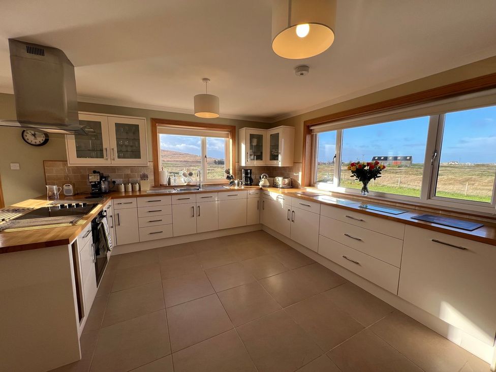 A kitchen with a window and countertops at Airigh nam Fiadh in Creagorry