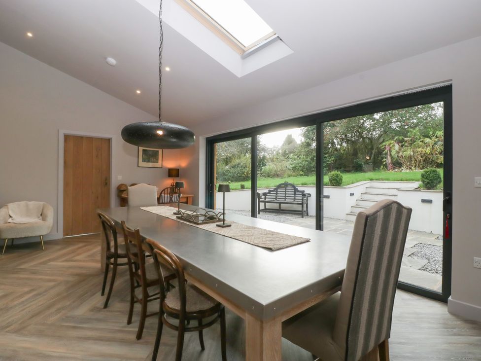 A dining room with a table and chairs at 3 bed property