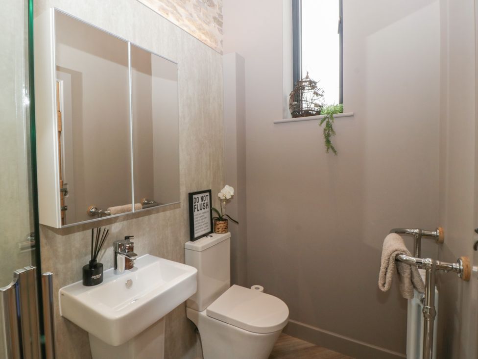 A bathroom with a sink and toilet at 3 bed property 