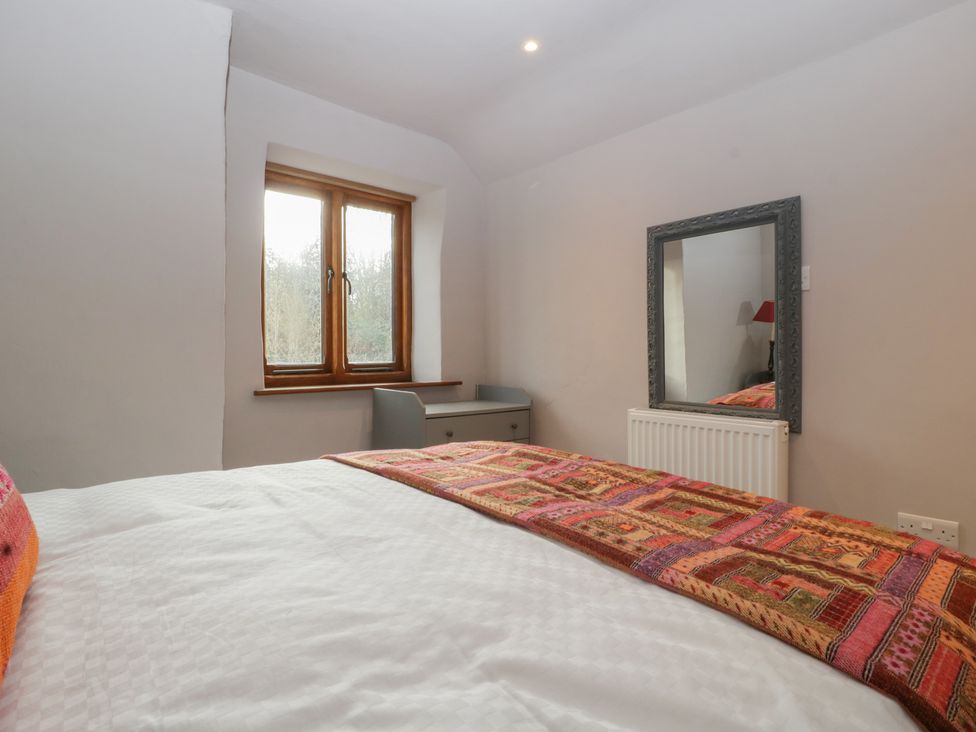 A bedroom with a bed and window at 3 bed property 