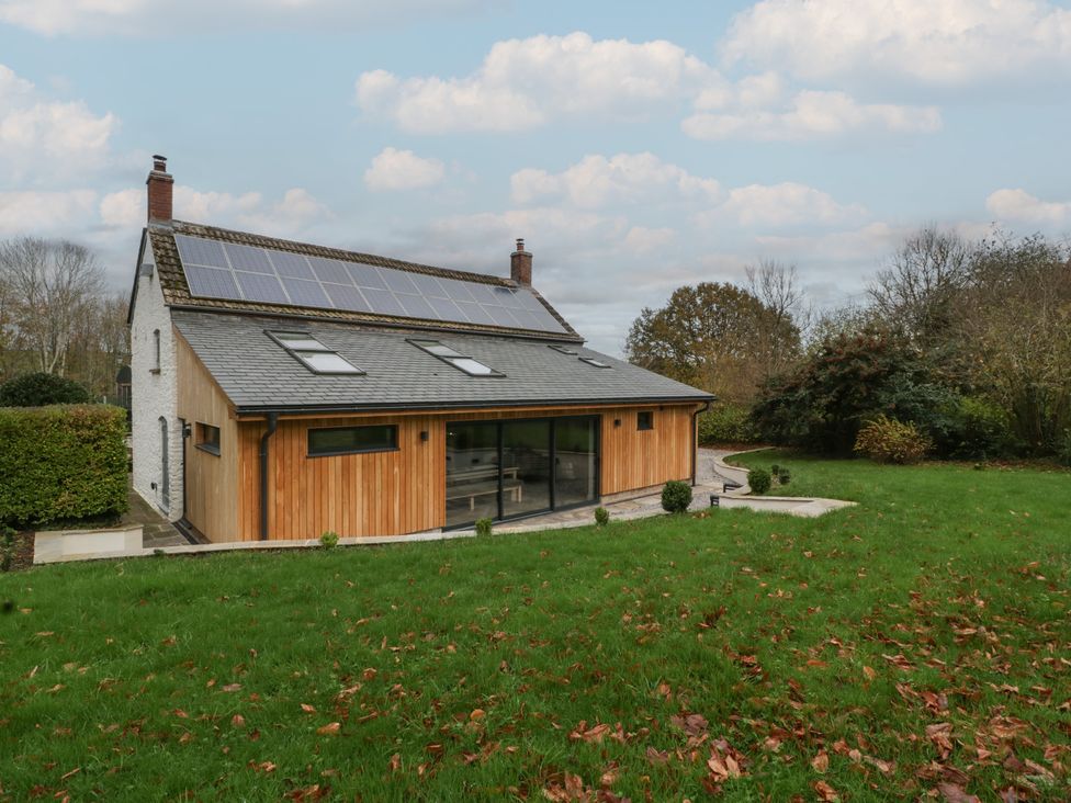 A house with solar panels and garden at a 3 bed property
