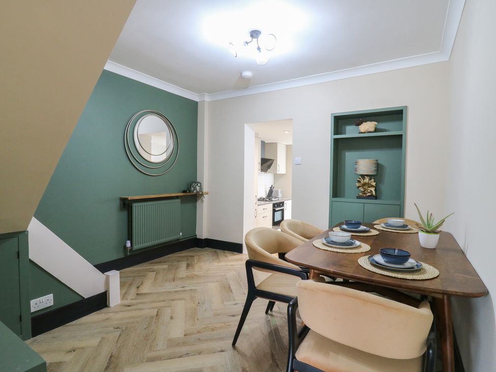 A dining room with a table and chairs at Seibiant in Ramsgate