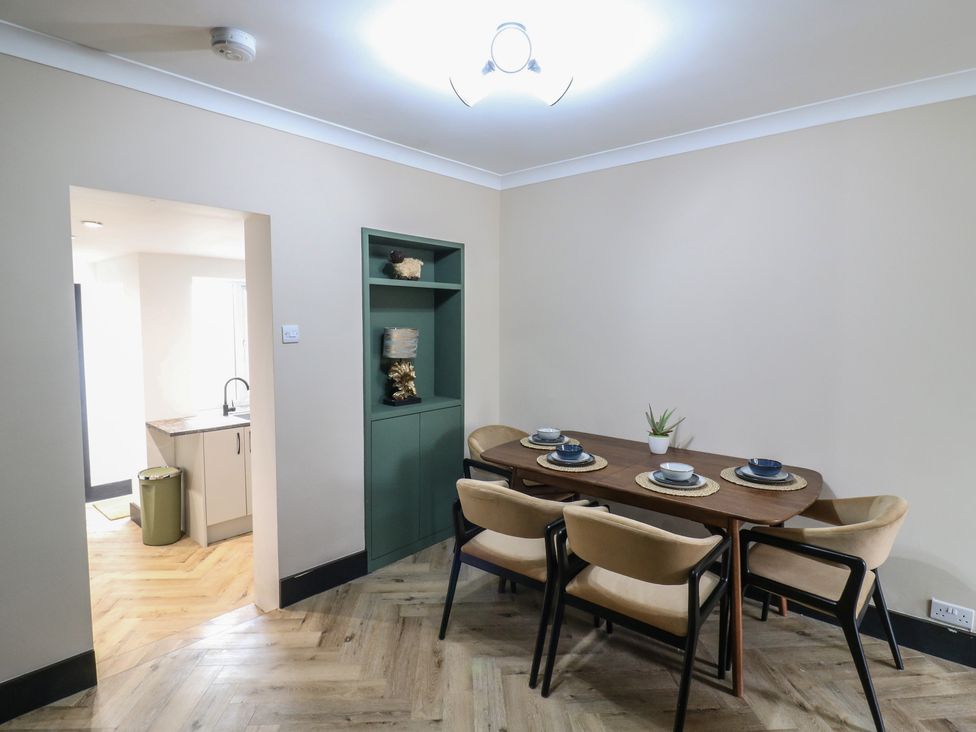A dining room with a table and chairs at Seibiant in Ramsgate